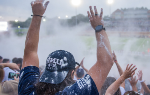 UNH fans watching football game